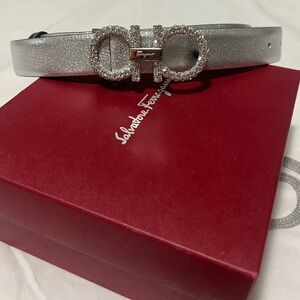 Brand new women’s Ferragamo belt. Reversible calf skin black and metallic silver